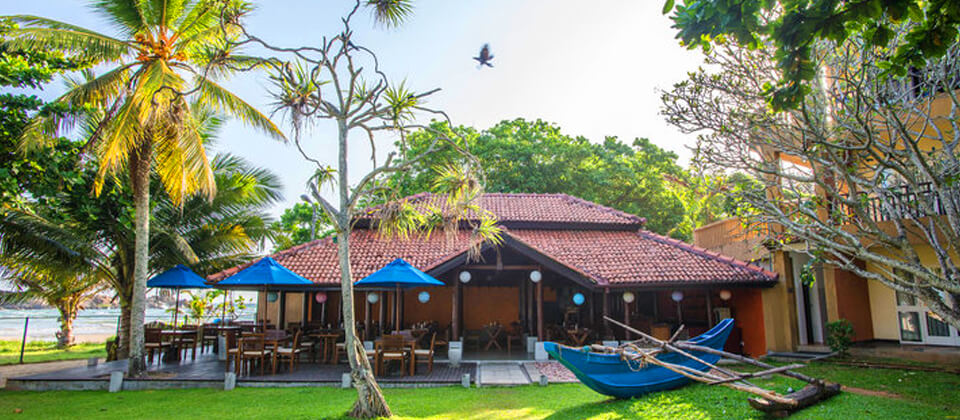 A seafood restaurant by the ocean at The Palms Hotel, Beruwala